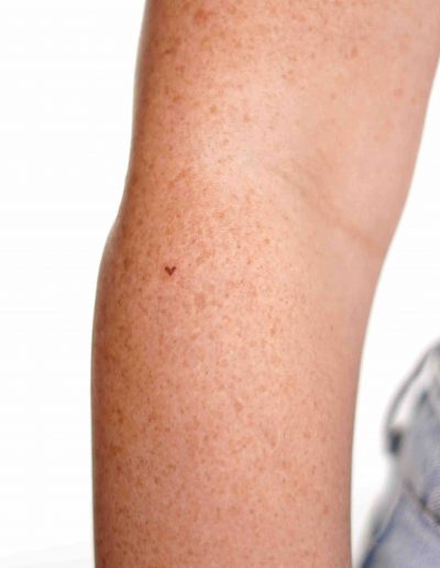 Freckle heart tattoo